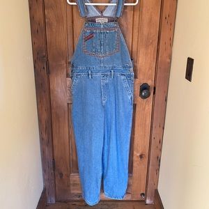 Vintage overalls with plaid lining on the bib.  Waist measures 17 inches.